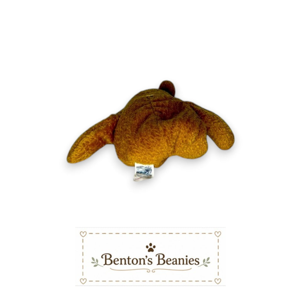 Benton's Beanies Germania the Bear Ty Beanie Baby in golden-brown plush with tush tag visible from the back