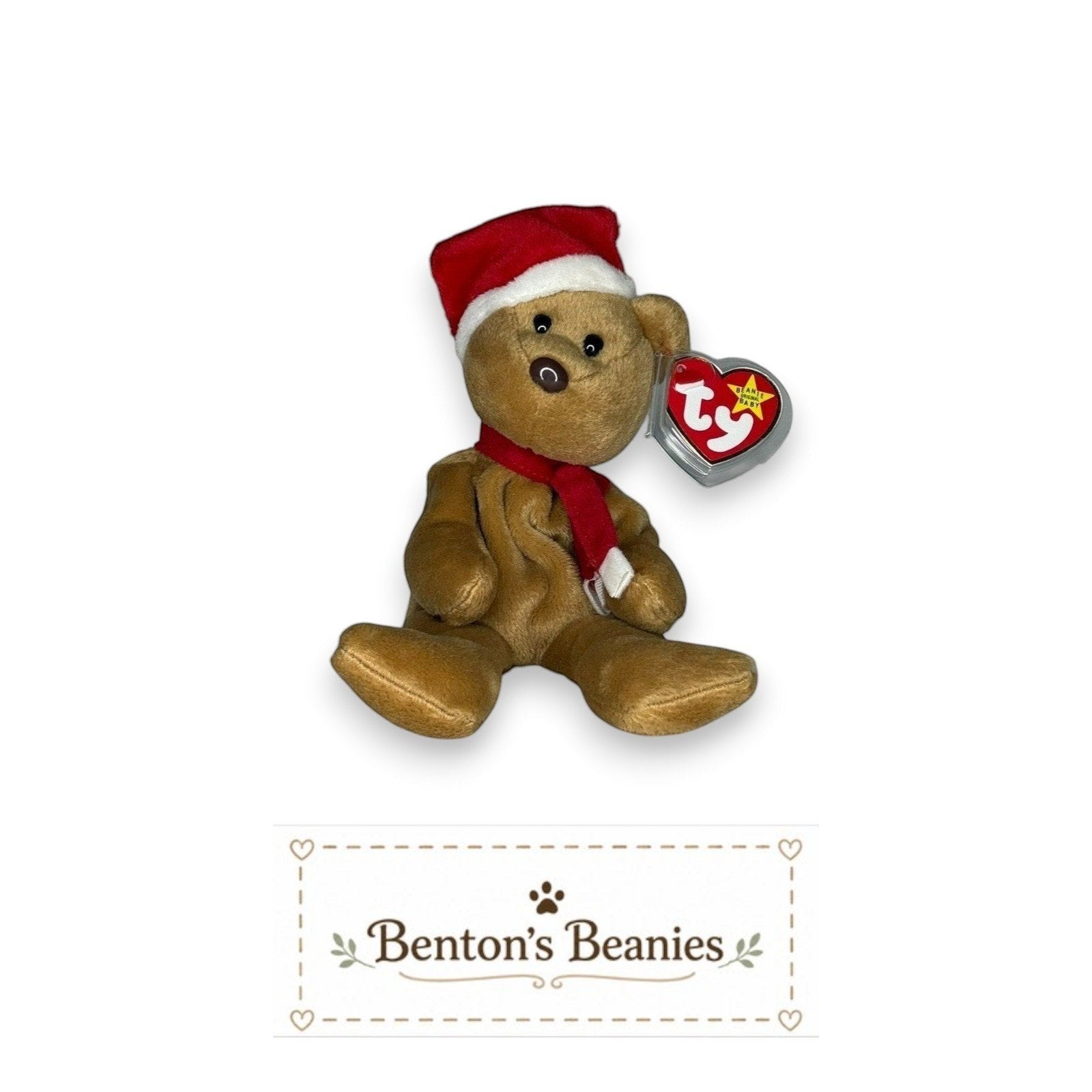 Benton's Beanies 1997 Holiday Teddy bear wearing a red Santa hat and scarf with a mint condition TY heart tag.