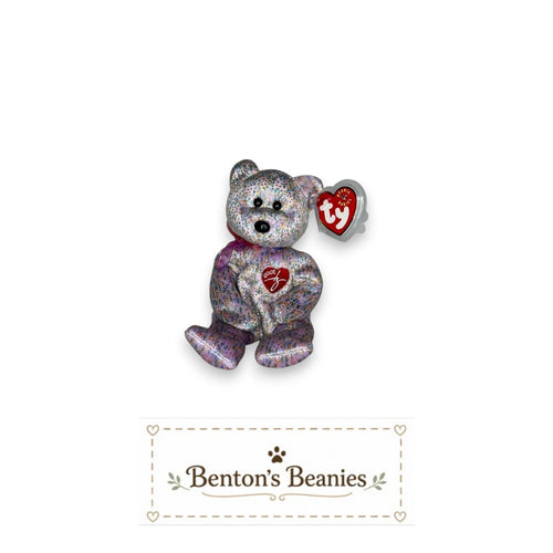 Benton's Beanie Babies 2001 Signature Bear, a plush toy with pastel confetti fabric, iridescent sparkle, and a red heart emblem with "2001" embroidered.