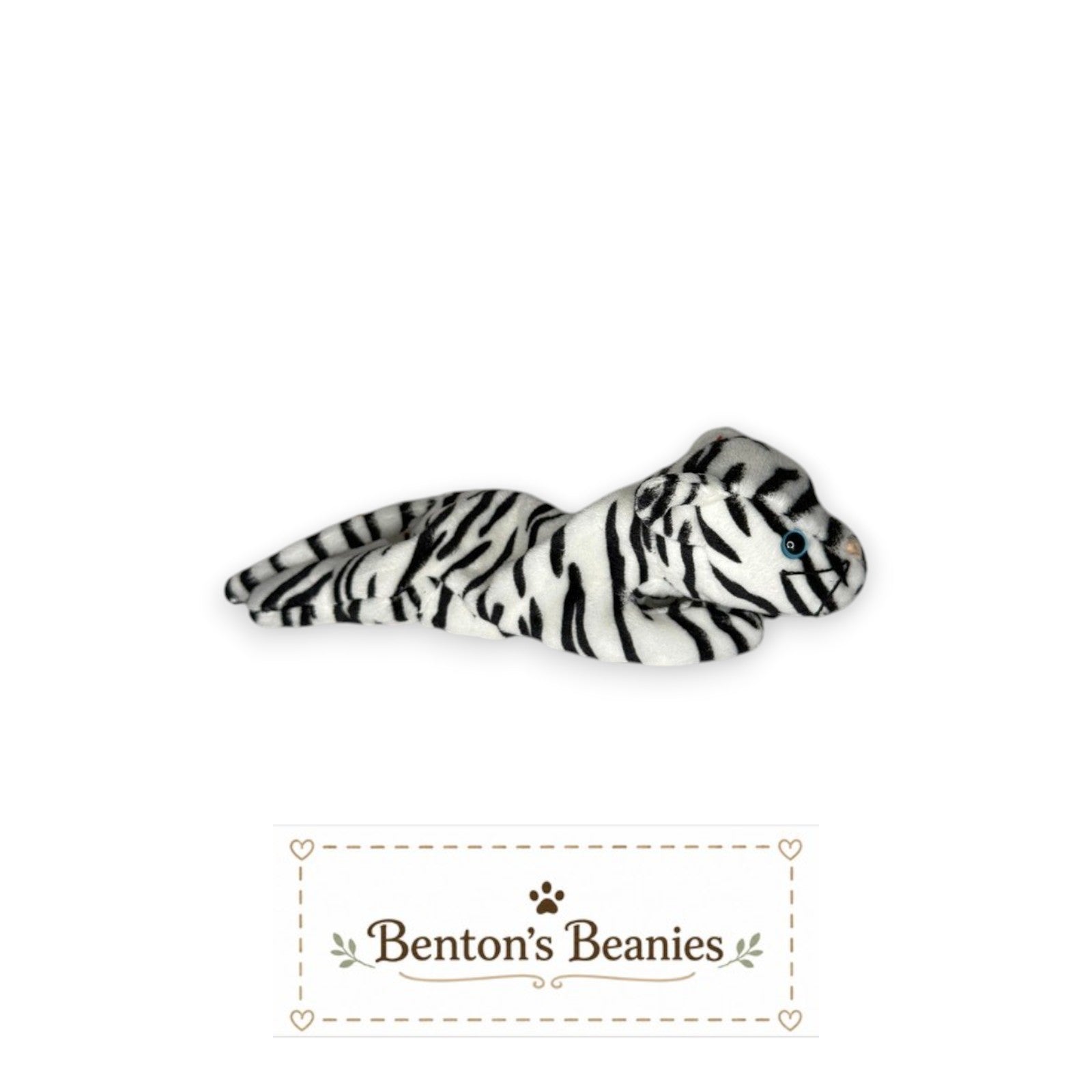 Benton's Beanies Blizzard the Snow Leopard TY Beanie Baby, white plush with black stripes and blue eyes, lying down.