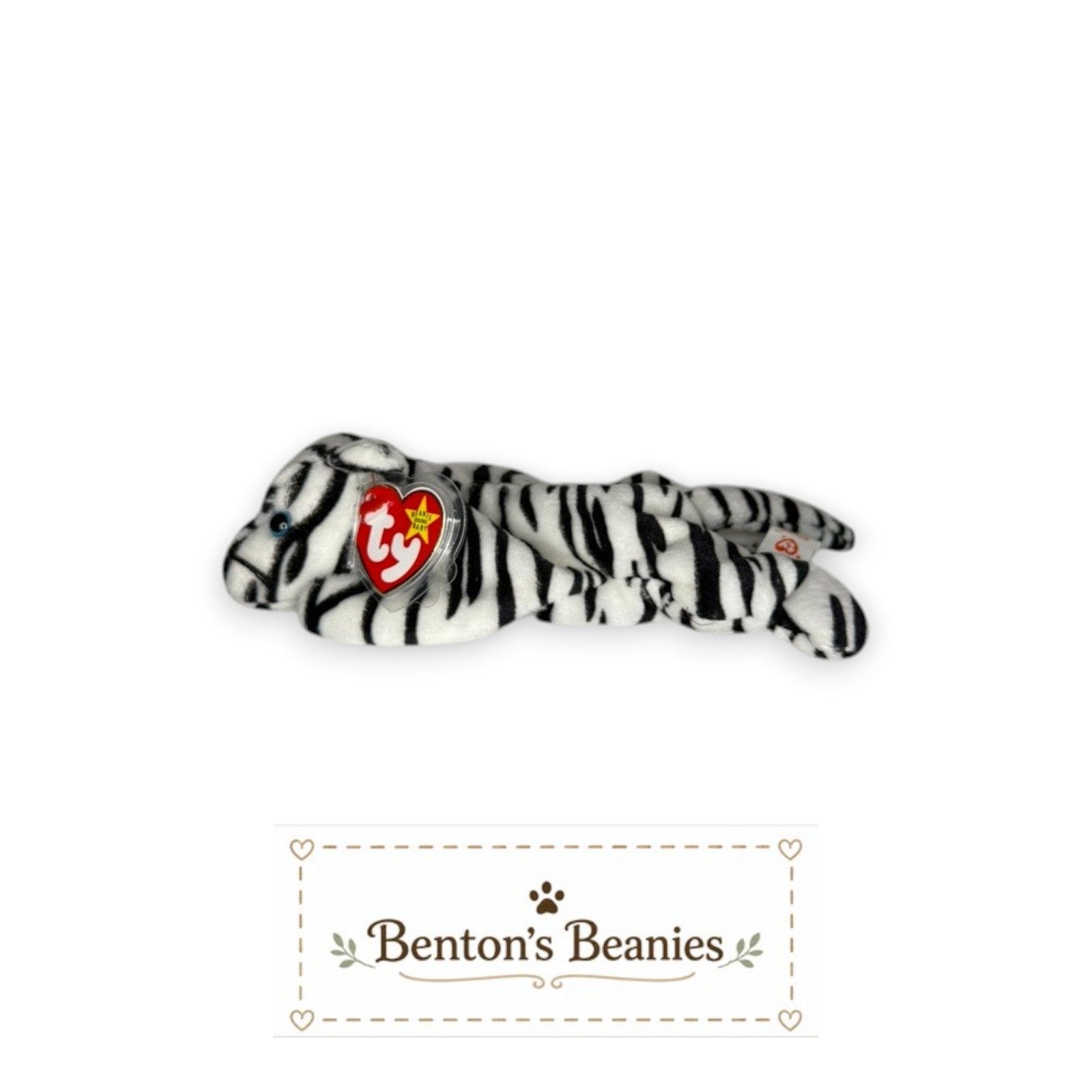 Benton's Beanies Blizzard the Snow Leopard TY Beanie Baby, white plush with black stripes and blue eyes, lying down.
