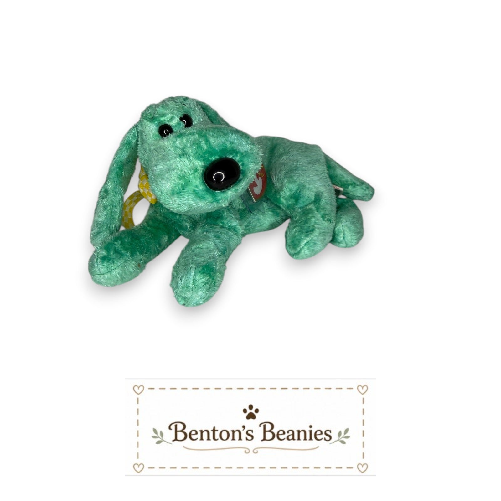 Benton's Beanies Diddley the Dog, a turquoise plush toy with floppy ears and a relaxed pose. Features an oversized nose and a yellow checkered ribbon.