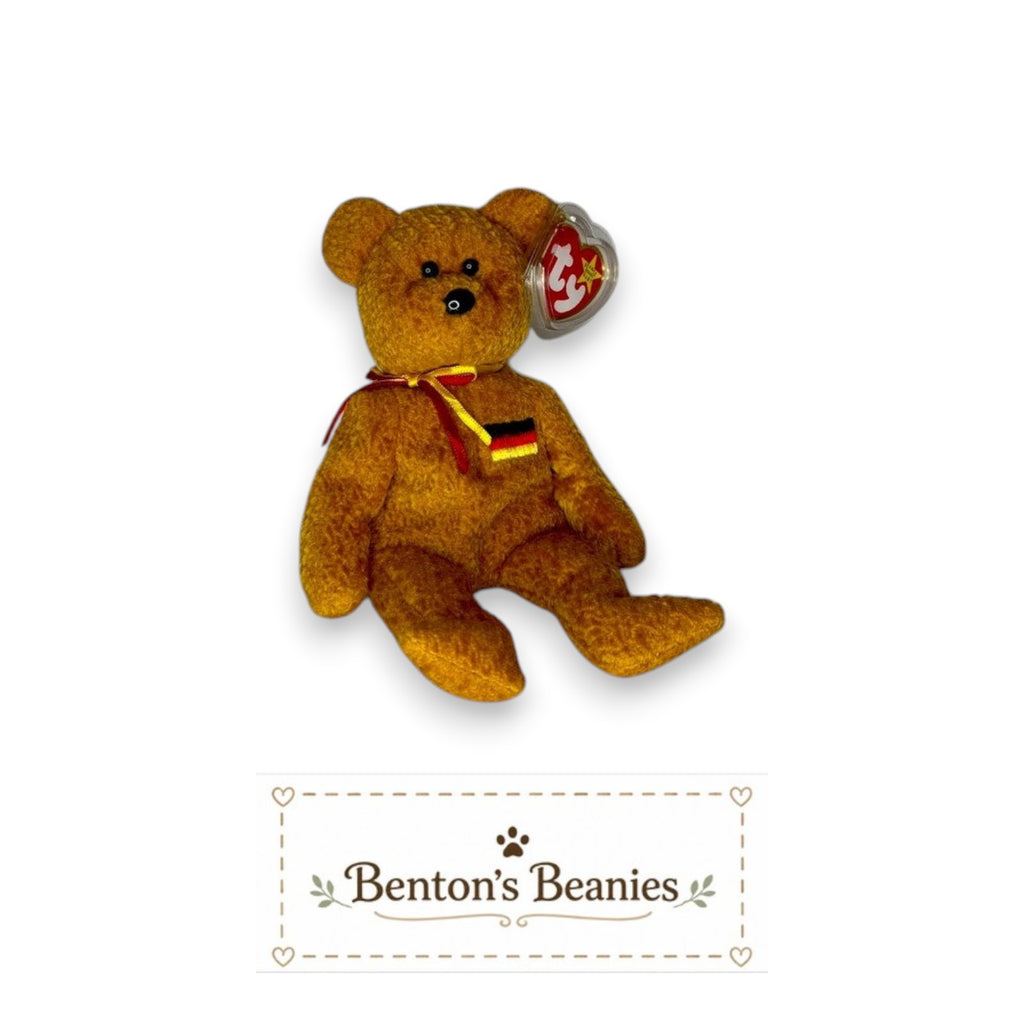 Benton's Beanies Germania Ty Beanie Baby, a golden-brown plush bear with a German flag chest patch and red ribbon.