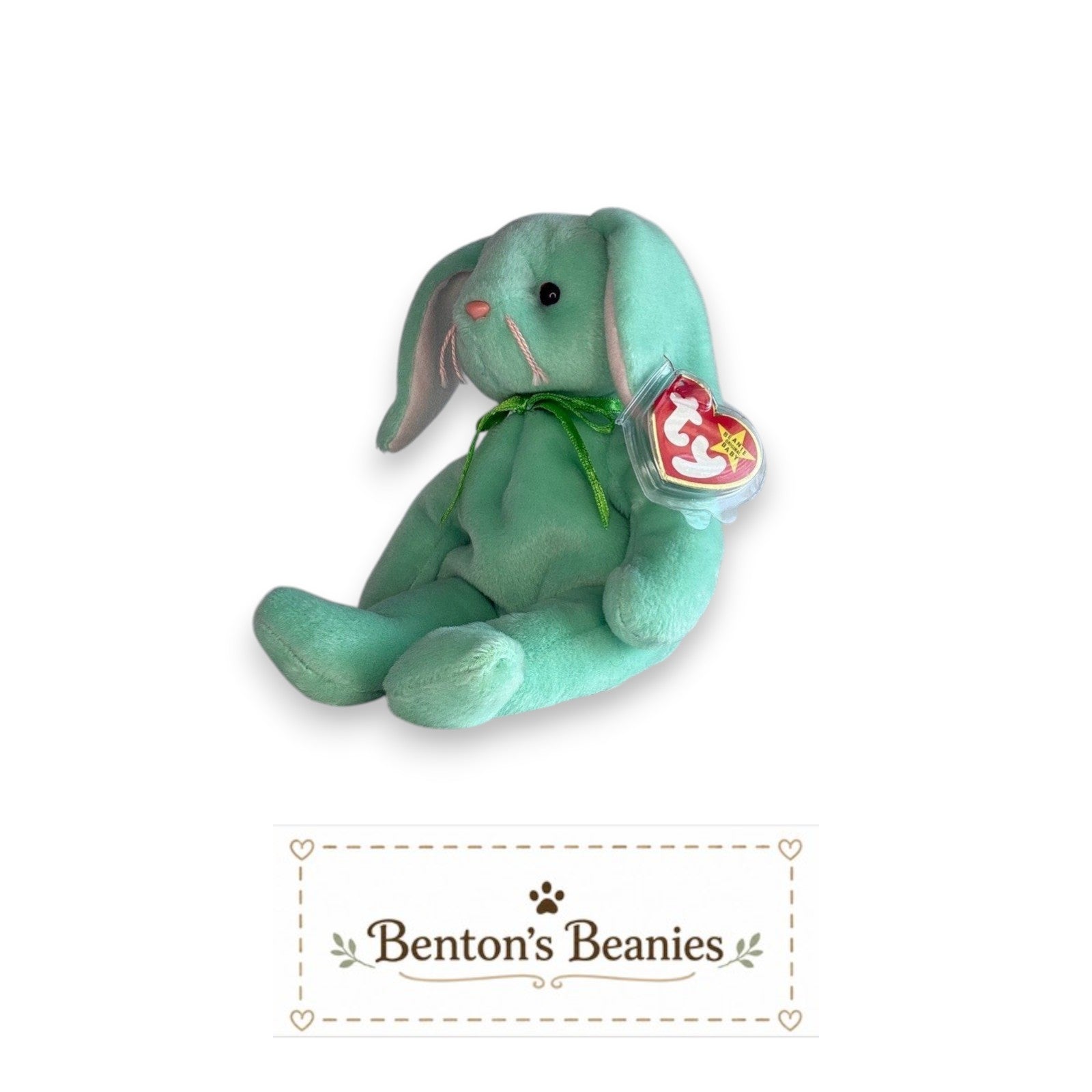 Benton's Beanies mint green plush rabbit with floppy ears and a green ribbon, sitting with a red heart tag.