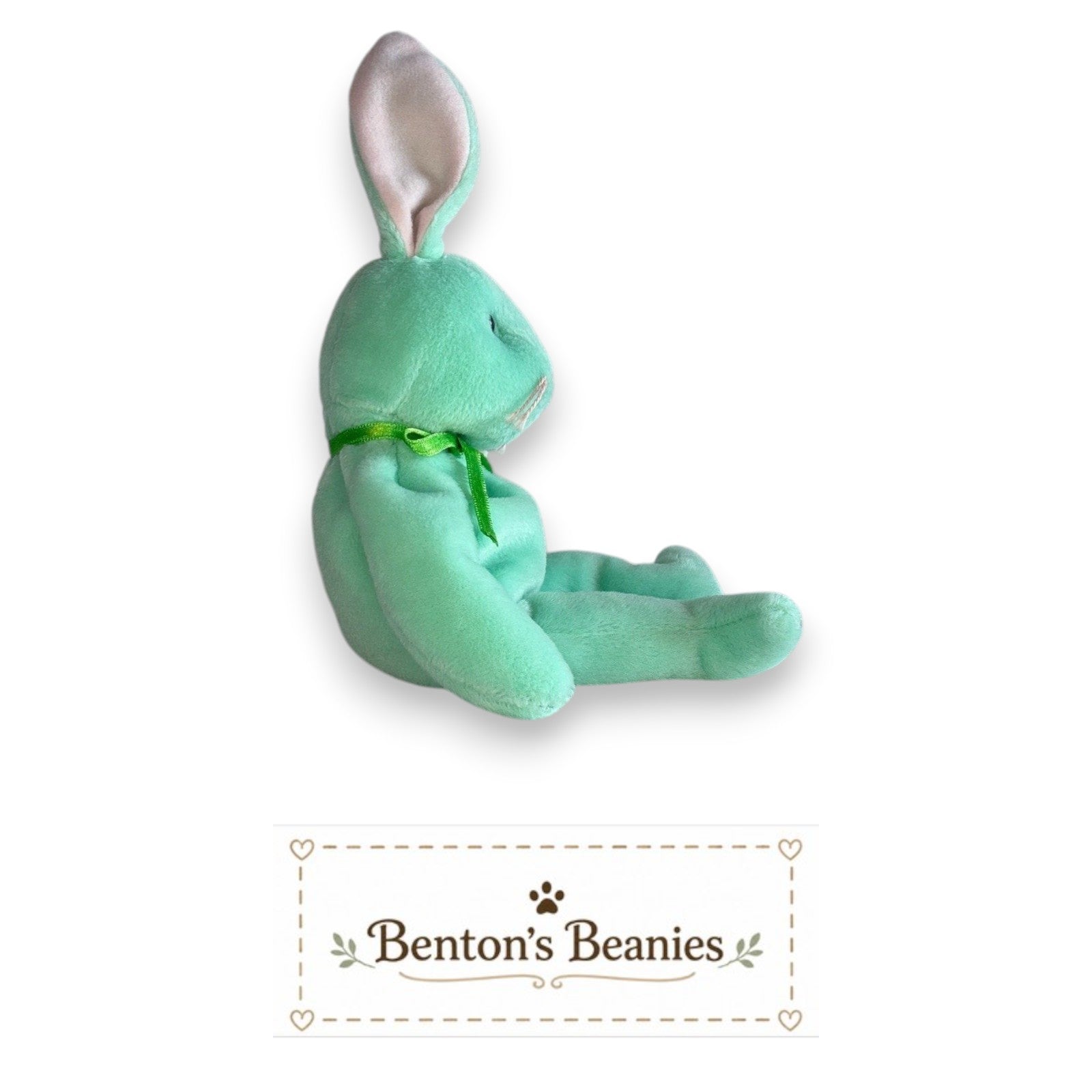 Benton's Beanies mint green plush rabbit stuffed animal with floppy ears and green ribbon.