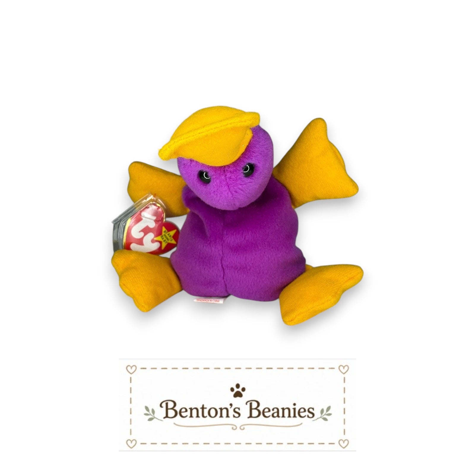 Benton's Beanies purple platypus plush toy with yellow feet, bill, and hat. Features mint heart and tush tags.