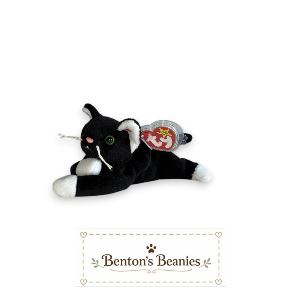 Benton's Beanies Zip the Cat plush toy with black and white fur, green eyes, and original Ty heart tag.