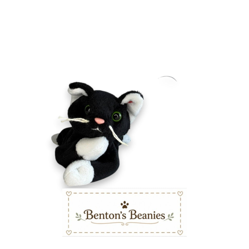 Benton's Beanies Zip the Cat Ty Beanie Baby with black and white plush fur, green eyes, and original heart tag
